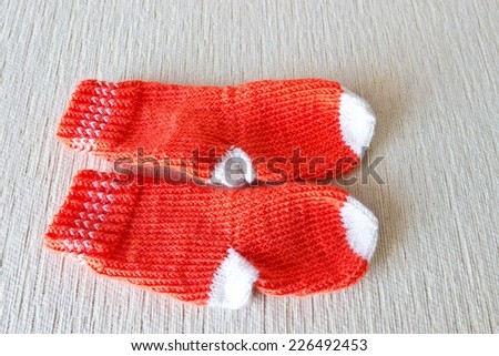 Colorful wool baby socks isolated on white background. Horizontal image