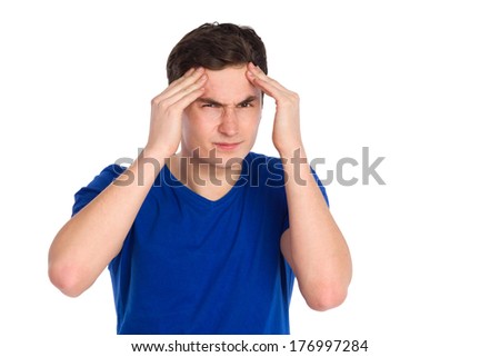 Headache, hangover. Close up of young man massaging head in pain. Waist up studio shot isolated on white.