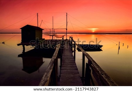 Sunset over lake pier landscape. Lake pier at sunset. Sunset lake pier. Sunset lake pier silhouette Foto d'archivio © 