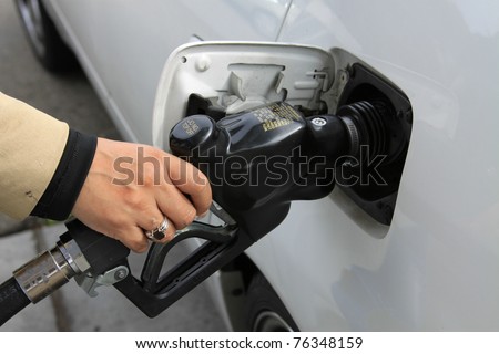 Person Pumping Gas