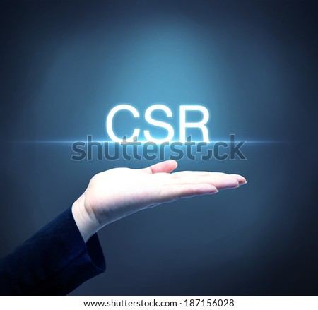 Business person raising hand with CSR concept / corporate social responsibility