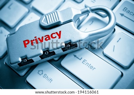Security lock with privacy message  on white computer keyboard - information privacy concept