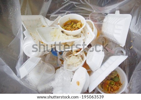 foam and plastic food container in the bin / environmental problems