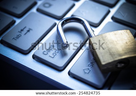 open security lock on computer keyboard - computer security breach concept