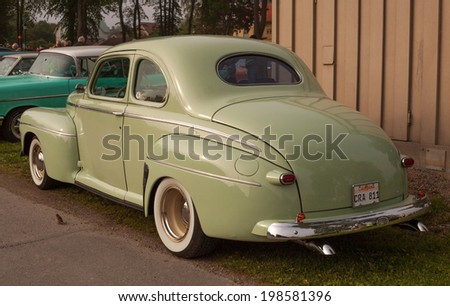 Trosa Sweden, June 5, 2014 veteran car meeting. FORD SUPER DE LUXE COUPE, model year 1946.