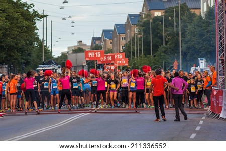 STOCKHOLM - AUG, 16: The start of little midnight run for boys and girls, fifteen years old. (Midnattsloppet) event. Aug 16, 2014 in Stockholm, Sweden