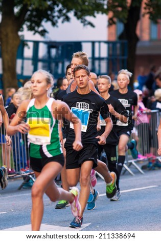 STOCKHOLM - AUG, 16: The start of little midnight run for boys and girls. (Midnattsloppet) event. Aug 16, 2014 in Stockholm, Sweden