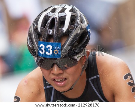 STOCKHOLM - AUG, 23:  World Triathlon  event Aug 23, 2014. woman, running in Old town, Stockholm, Sweden.  Yurie Kato, JAPAN.