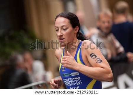 STOCKHOLM - AUG, 23:  World Triathlon  event Aug 23, 2014. woman running in Old town, Stockholm, Sweden. ÅSA ANNERSTEDT, SWEDEN..