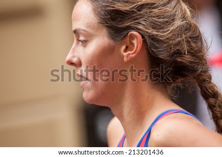 STOCKHOLM - AUG, 23:  World Triathlon  event Aug 23, 2014. woman running in Old town, Stockholm, Sweden. Carolina Routier, ESP.