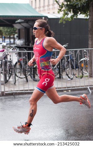 STOCKHOLM - AUG, 23:  World Triathlon  event Aug 23, 2014. woman running in Old town, Stockholm, Sweden. Ainhoa Murua, ESP.