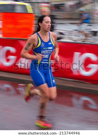 STOCKHOLM - AUG, 23:  World Triathlon  event Aug 23, 2014. woman running in Old town, Stockholm, Sweden. Asa Annerstedt, Sweden.