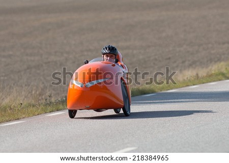 MORKO SWEDEN, September 18, 2014, biker on tour in a Velomobile. A man on a bike ride in an unusual vehicle.