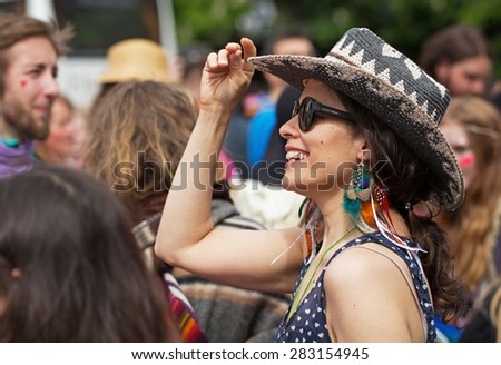 STOCKHOLM, SWEDEN - MAY 31, 2015. Peace and Love Parade. Street party in Stockholm, Young happy woman in hat.