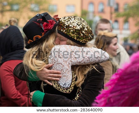 STOCKHOLM, SWEDEN - MAY 31, 2015. Peace and Love Parade. Street party in Stockholm. Two hugging women.