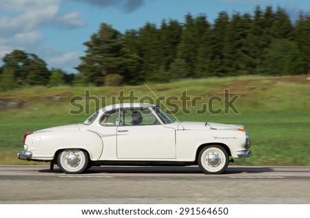 TROSA SWEDEN, 25 JUNI 2015. BORGWARD. Lonely man in his white car, heading towards Trosa car meet.