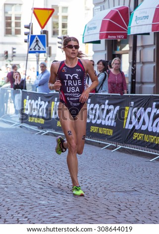 STOCKHOLM - AUG, 22:  Woman ITU World Triathlon  event Aug 22 2015. Woman running in Old town, Stockholm, Sweden, SARAH TRUE USA The Gold winner ladies.