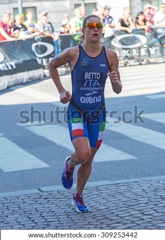 STOCKHOLM - AUG, 22: Woman ITU  World Triathlon event Aug 22 2015. Woman running in Old town. Alice Betto. ITA