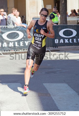 STOCKHOLM - AUG, 22:  Woman ITU World Triathlon  event Aug 22 2015. Woman running in Old town. Anja Knapp. Total final results in Stockholm 11th.