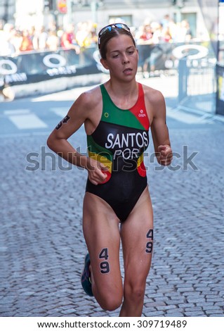 STOCKHOLM - AUG 22: Women ITU World Triathlon event Aug 22 2015. Woman running in Old town.  Melanie Santos. (POR)