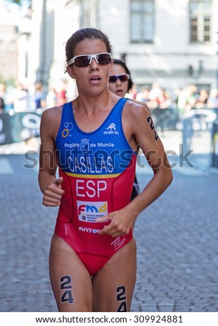 STOCKHOLM - AUG 22: Women ITU World Triathlon event Aug 22 2015. Woman running in Old town.  Casillas GarcÃ?ÃÂ­a Miriam (ESP)