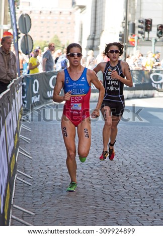 STOCKHOLM - AUG 22: Women ITU World Triathlon event Aug 22 2015. Woman running in Old town. Casillas GarcÃ?Â­a Miriam.
