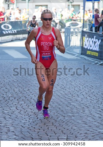 STOCKHOLM - AUG 22: Women ITU World Triathlon event Aug 22 2015. Woman running in Old town. Peron Gaia.