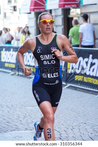 STOCKHOLM - AUG 22: Women ITU World Triathlon event Aug 22 2015. Woman running in Old town. Simic, Mateja (SLO).