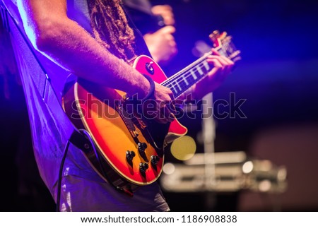 Similar – Image, Stock Photo Man with electric bass and bare feet on wooden bench on terrace in autumn