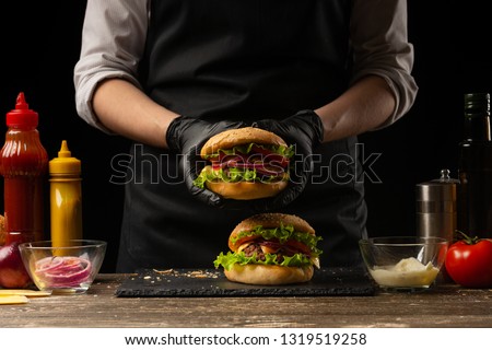 Similar – Image, Stock Photo Chef preparing burgers at grill plate on international urban street food festival.