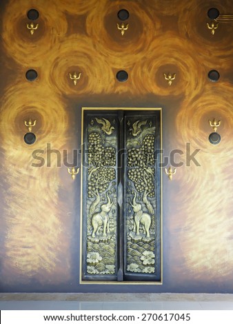 door made of wood and carved with the delicate and beautiful.