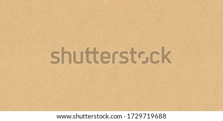 High resolution seamless yellow cardboard background or texture hard paper sheet. Beige recycled eco carton paper or seamless carton background. Yellow paperboard texture. ストックフォト © 