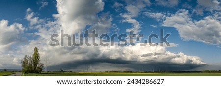 Similar – Image, Stock Photo Eerie cloud formation over the vast land