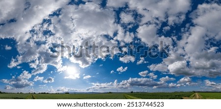 Similar – Image, Stock Photo Fair weather clouds in front of a blue sky and a small section of a red tiled roof with a parabolic antenna / satellite dish / football transmission