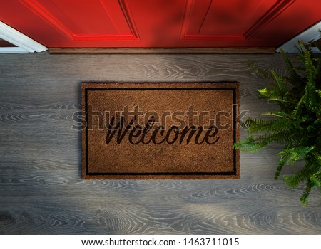 Overhead view of welcome mat outside inviting front door of house with potted fern plant Foto d'archivio © 