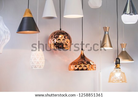 Different modern streamlined mirror copper chandeliers. Bubble metal copper shade pendant.