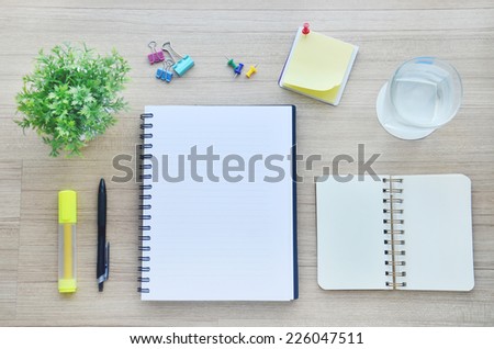 Background : blank paper and office tools on the wood table - Top view