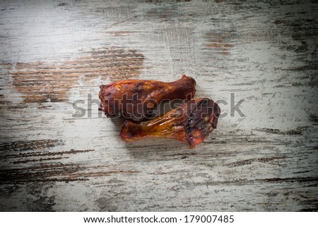 Grilled chicken Legs on the vintage backgound