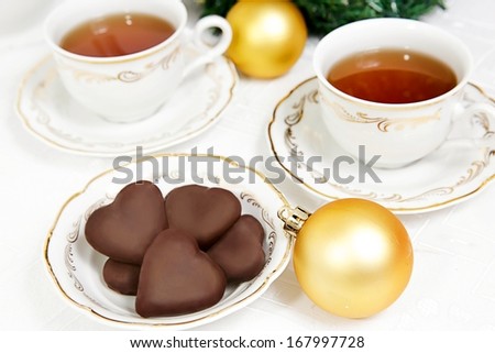 Christmas tea party with chocolate and Christmas ornaments.