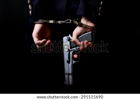 Woman hands in handcuffs (close-up)