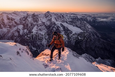 Image, Stock Photo Traveler contemplating snowy ridge in sunlight
