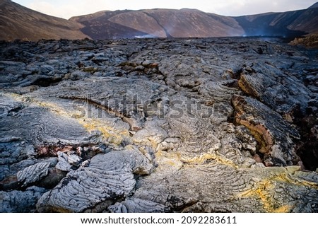 Close up view of cracked lava crust or ingenious rock and steam, cooled down from 2021 eruption of volcano Mt. Fagradalsfjall in Geldingadalir valley on Reykjanes Peninsula near Grindavik, Iceland Foto stock © 