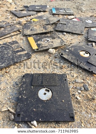 Similar – Image, Stock Photo A discarded floppy disk looks wistfully at the USB stick, which the mouse pointer prefers