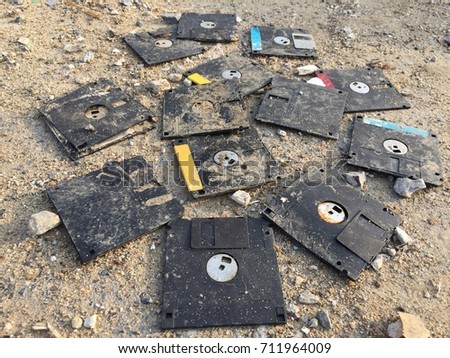 Similar – Image, Stock Photo A discarded floppy disk looks wistfully at the USB stick, which the mouse pointer prefers