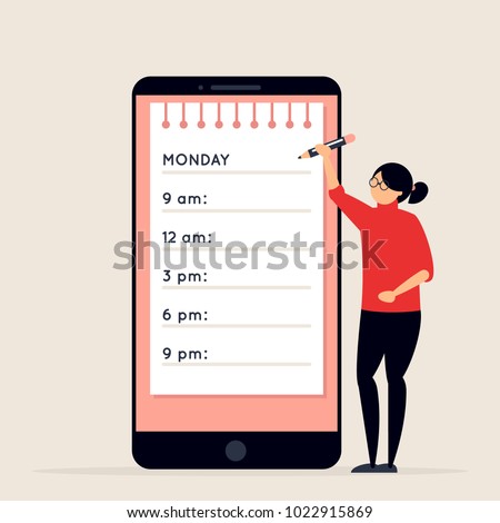 Day planning and scheduling concept. Young woman with pencil standing next to big smartphone with calendar on its screen. Girl making notes in planner app. Time organizer
