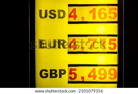 Currency exchange place (to PLN, Polish zloty), bureau de change different three top currency rates, USD, EUR, GBP prices board closeup, 2022, nobody, at night. Value, money, popular world currencies Imagine de stoc © 
