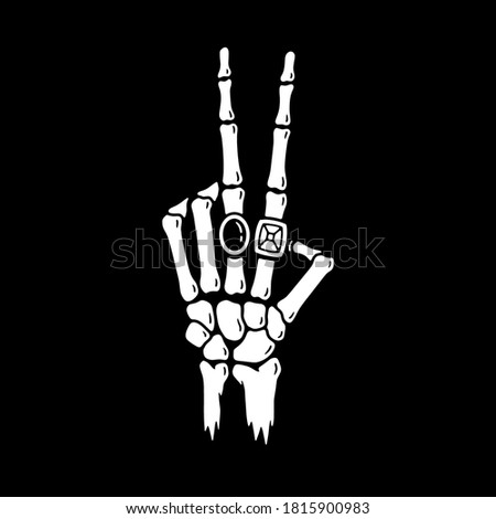 SKELETON HAND WITH RINGS WHITE BLACK BACKGROUND