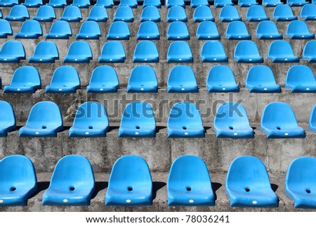 old plastic blue seats on football stadium
