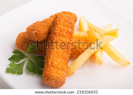 Fish sticks and french fries on the plate