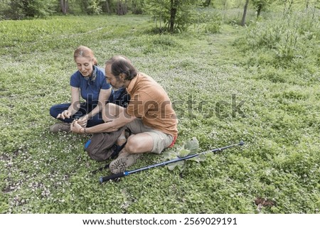 Similar – Image, Stock Photo Hiker observing forest in binoculars